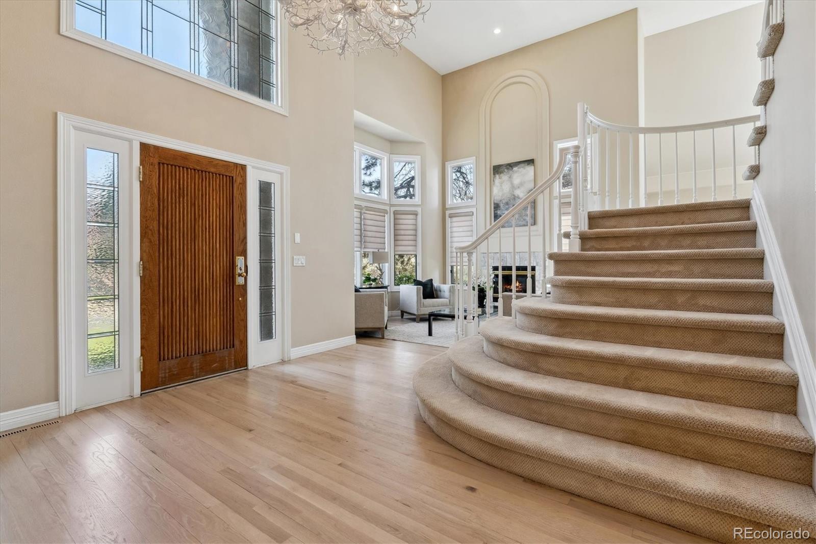 72 Falcon Hills Drive Highlands Ranch, CO 80126 - Photo 4 of 49 a view of entryway and hall with wooden floor