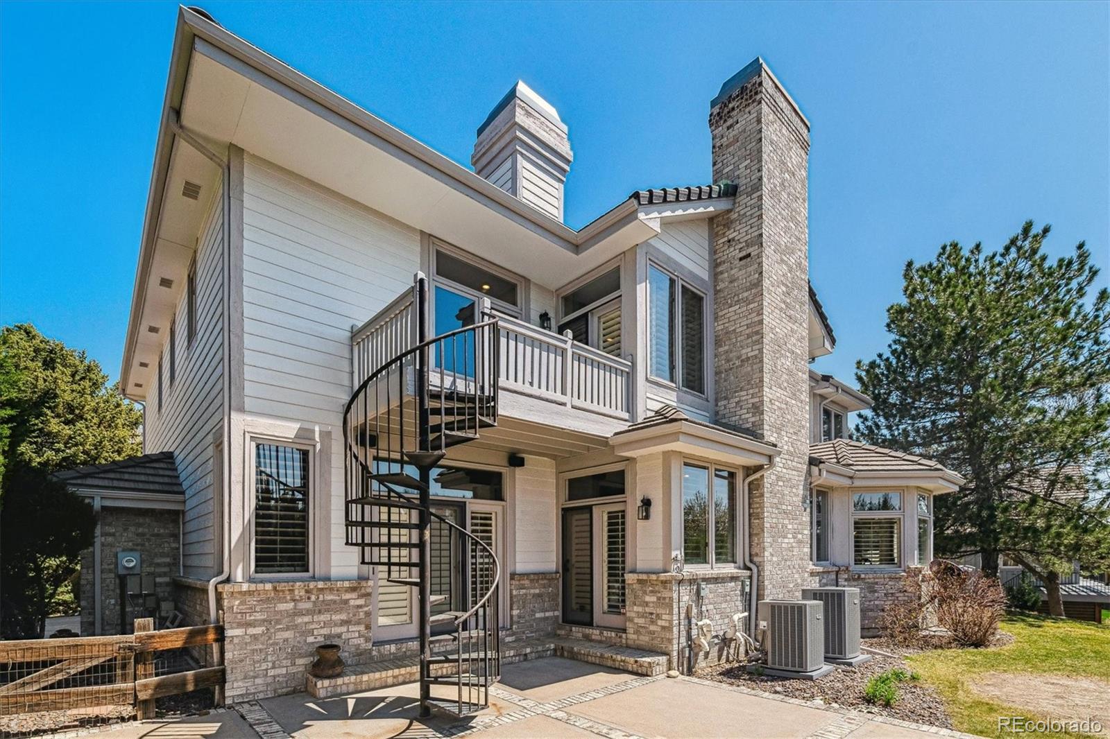 72 Falcon Hills Drive Highlands Ranch, CO 80126 - Photo 43 of 49 a front view of a house with garden