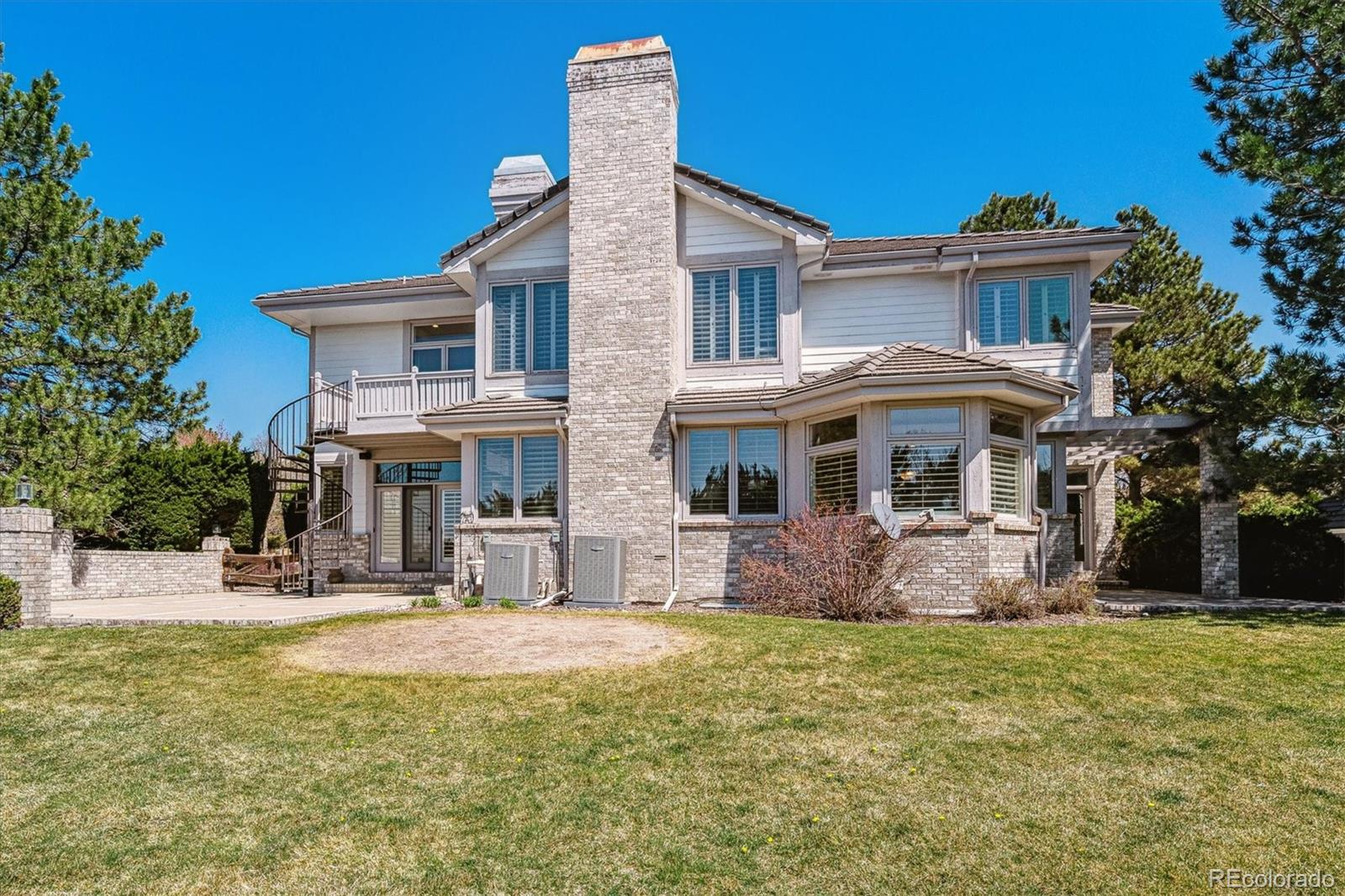 72 Falcon Hills Drive Highlands Ranch, CO 80126 - Photo 45 of 49 a front view of a house with garden