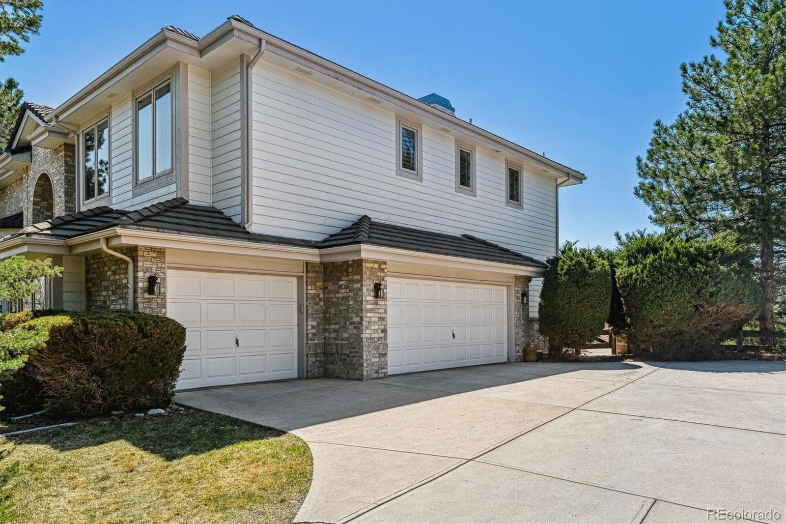 72 Falcon Hills Drive Highlands Ranch, CO 80126 - Photo 48 of 49 a view of a house with a yard