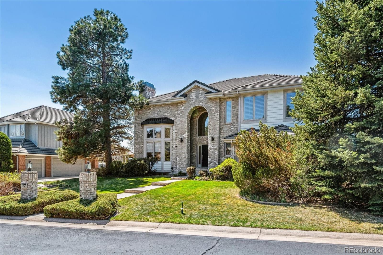 72 Falcon Hills Drive Highlands Ranch, CO 80126 - Photo 49 of 49 a front view of a house with garden