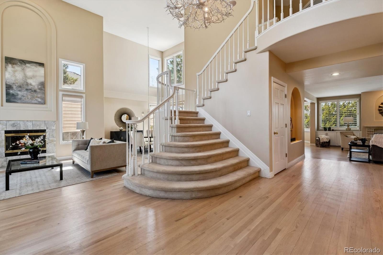72 Falcon Hills Drive Highlands Ranch, CO 80126 - Photo 5 of 49 a view of entryway livingroom and hall with wooden floor