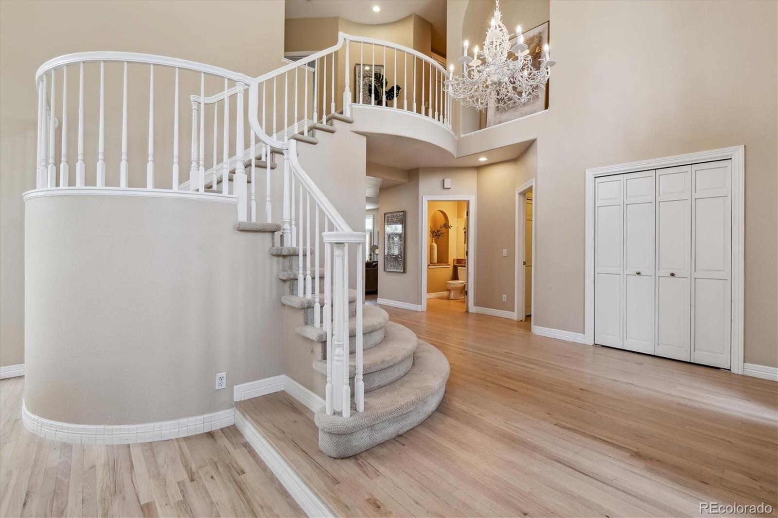 72 Falcon Hills Drive Highlands Ranch, CO 80126 - Photo 6 of 49 a view of entryway and hall with wooden floor