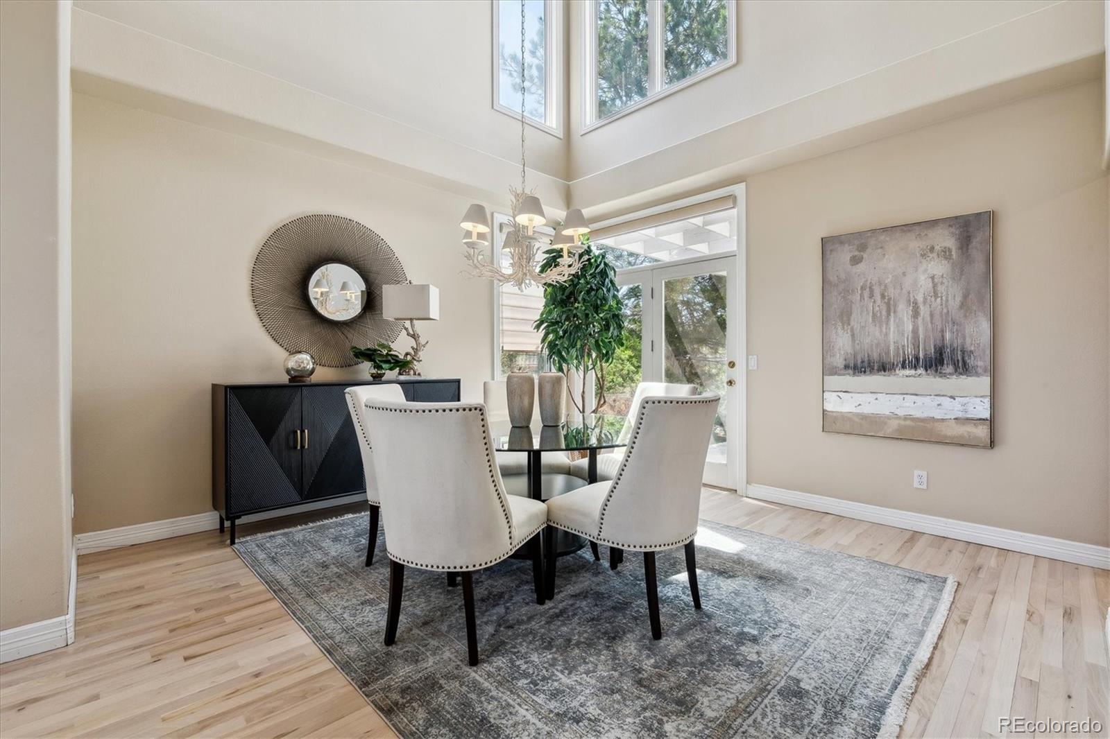 72 Falcon Hills Drive Highlands Ranch, CO 80126 - Photo 10 of 49 a view of a dining room with furniture window and wooden floor