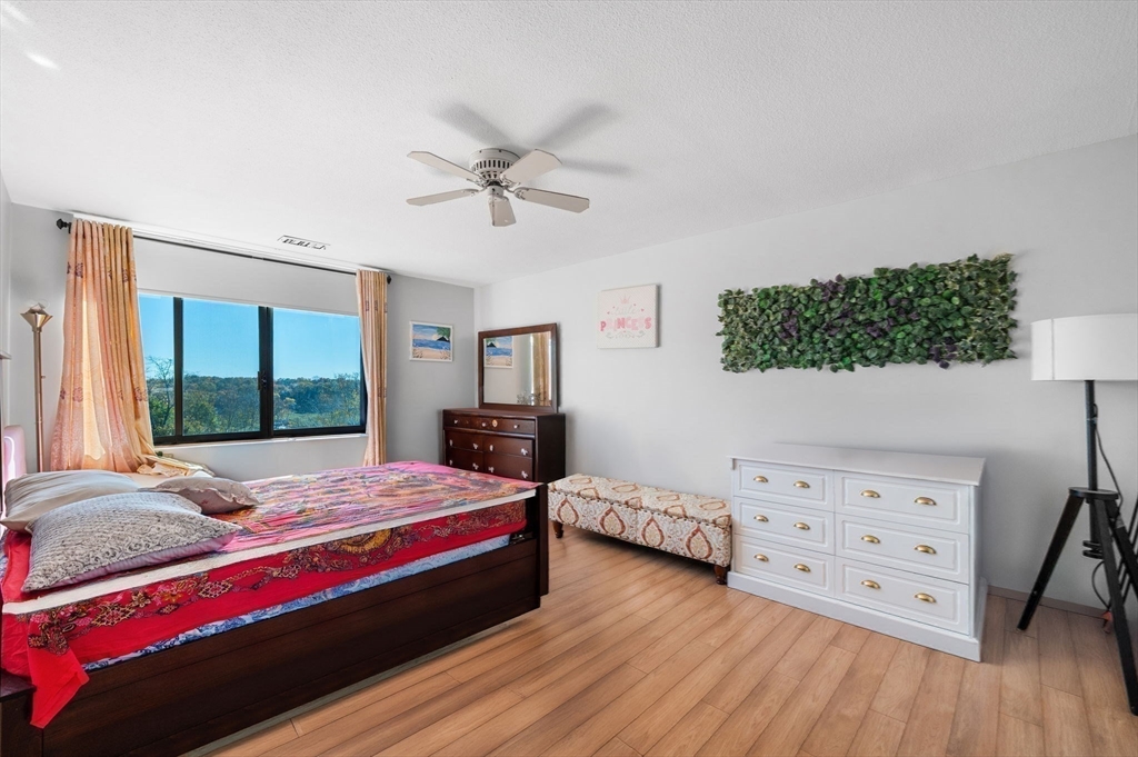 1004 Paradise Road, Unit PHJ Swampscott, MA 01907 - Photo 17 of 29 a bedroom with a bed and a dresser