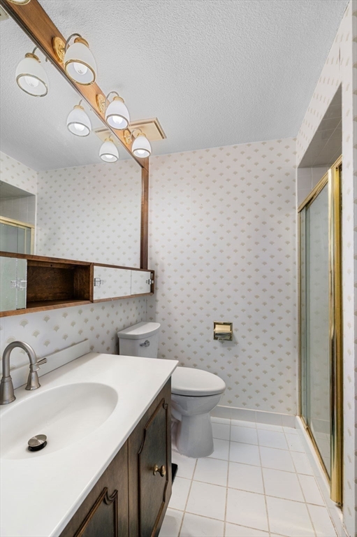 1004 Paradise Road, Unit PHJ Swampscott, MA 01907 - Photo 18 of 29 a bathroom with a sink a toilet and mirror