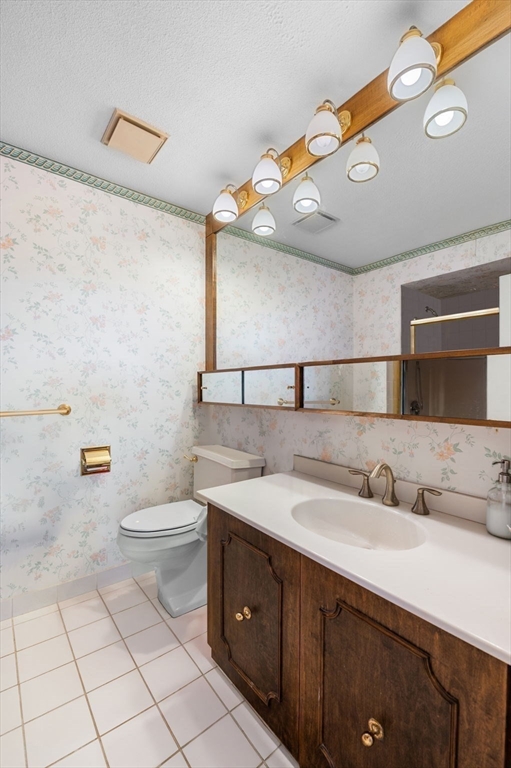 1004 Paradise Road, Unit PHJ Swampscott, MA 01907 - Photo 19 of 29 a bathroom with a sink a toilet and mirror