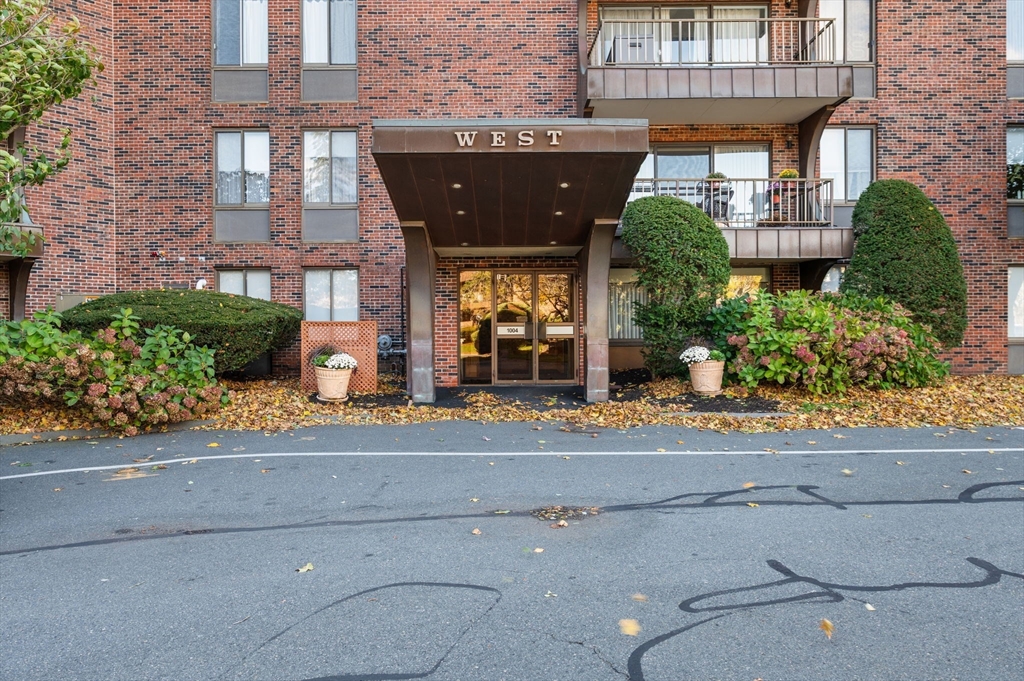 1004 Paradise Road, Unit PHJ Swampscott, MA 01907 - Photo 2 of 29 front view of building with potted plants