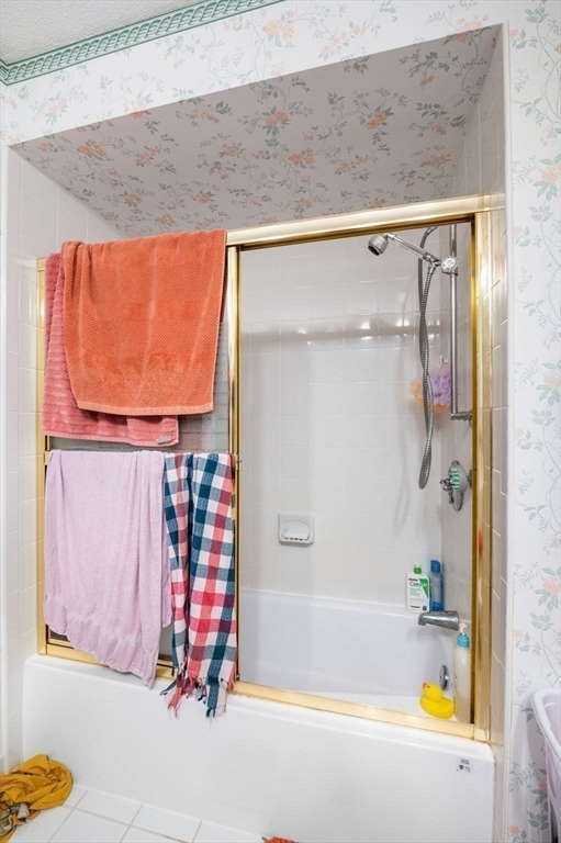 1004 Paradise Road, Unit PHJ Swampscott, MA 01907 - Photo 21 of 29 a bathroom with a bathtub and shower