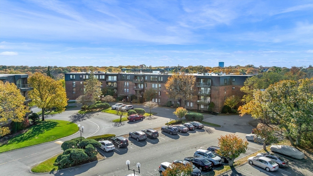 1004 Paradise Road, Unit PHJ Swampscott, MA 01907 - Photo 27 of 29 an aerial view of a house with a garden and lake view