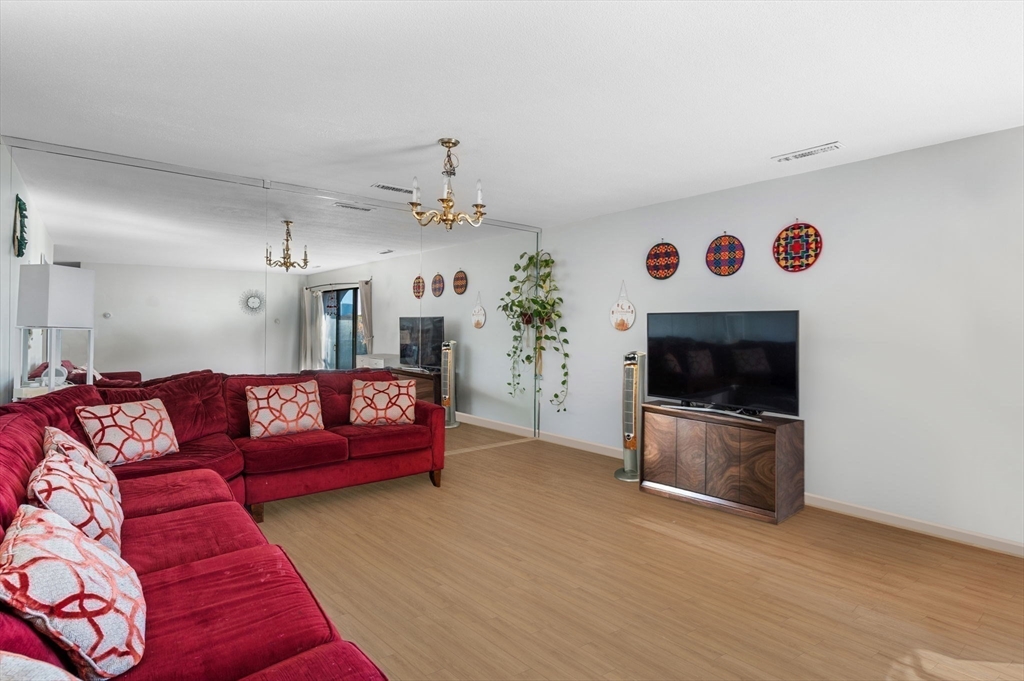 1004 Paradise Road, Unit PHJ Swampscott, MA 01907 - Photo 7 of 29 a living room with furniture and a fireplace