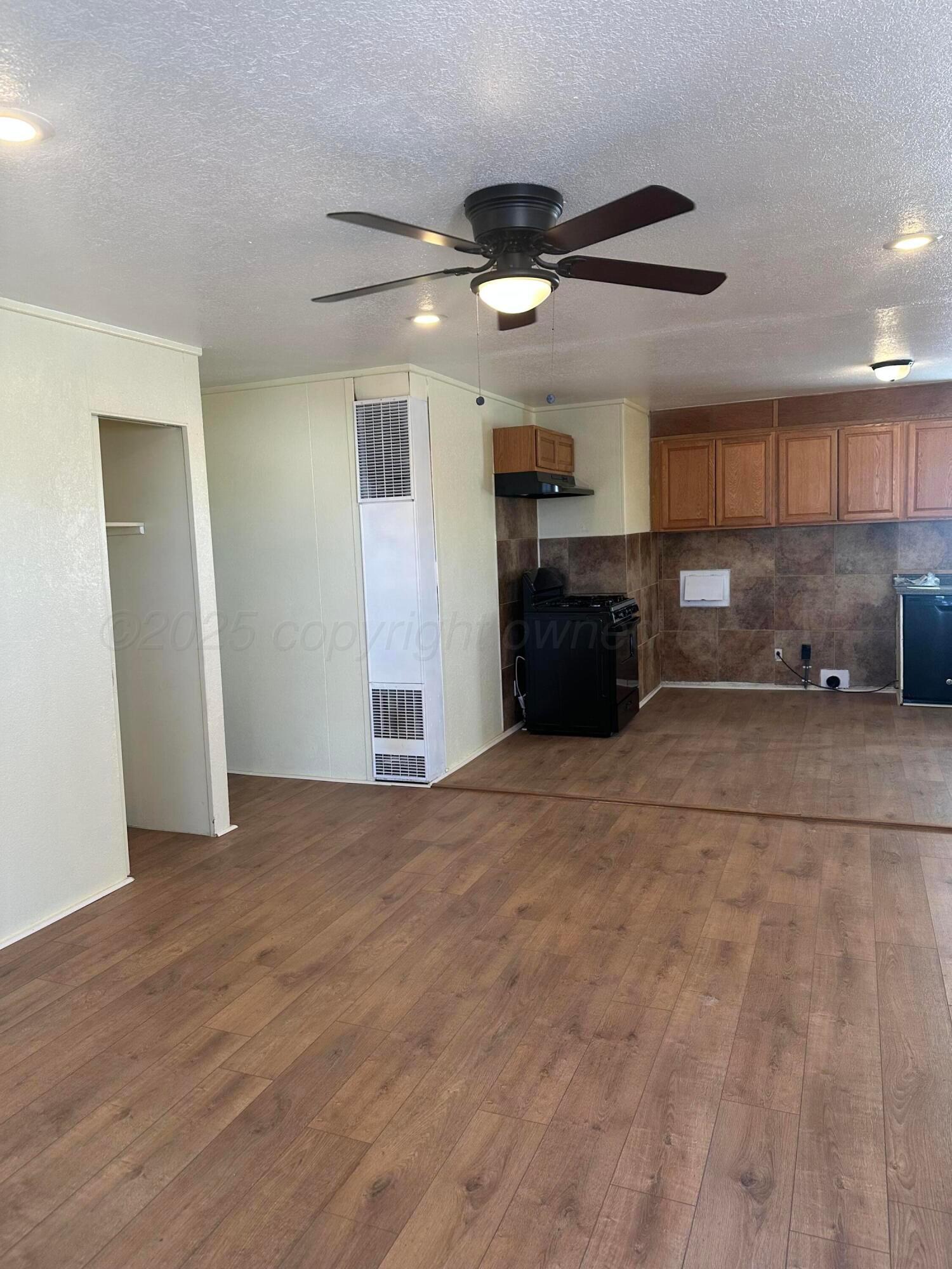 1012 Harper Street Amarillo, TX 79107 - Photo 4 of 22 a view of a kitchen with a sink and a refrigerator