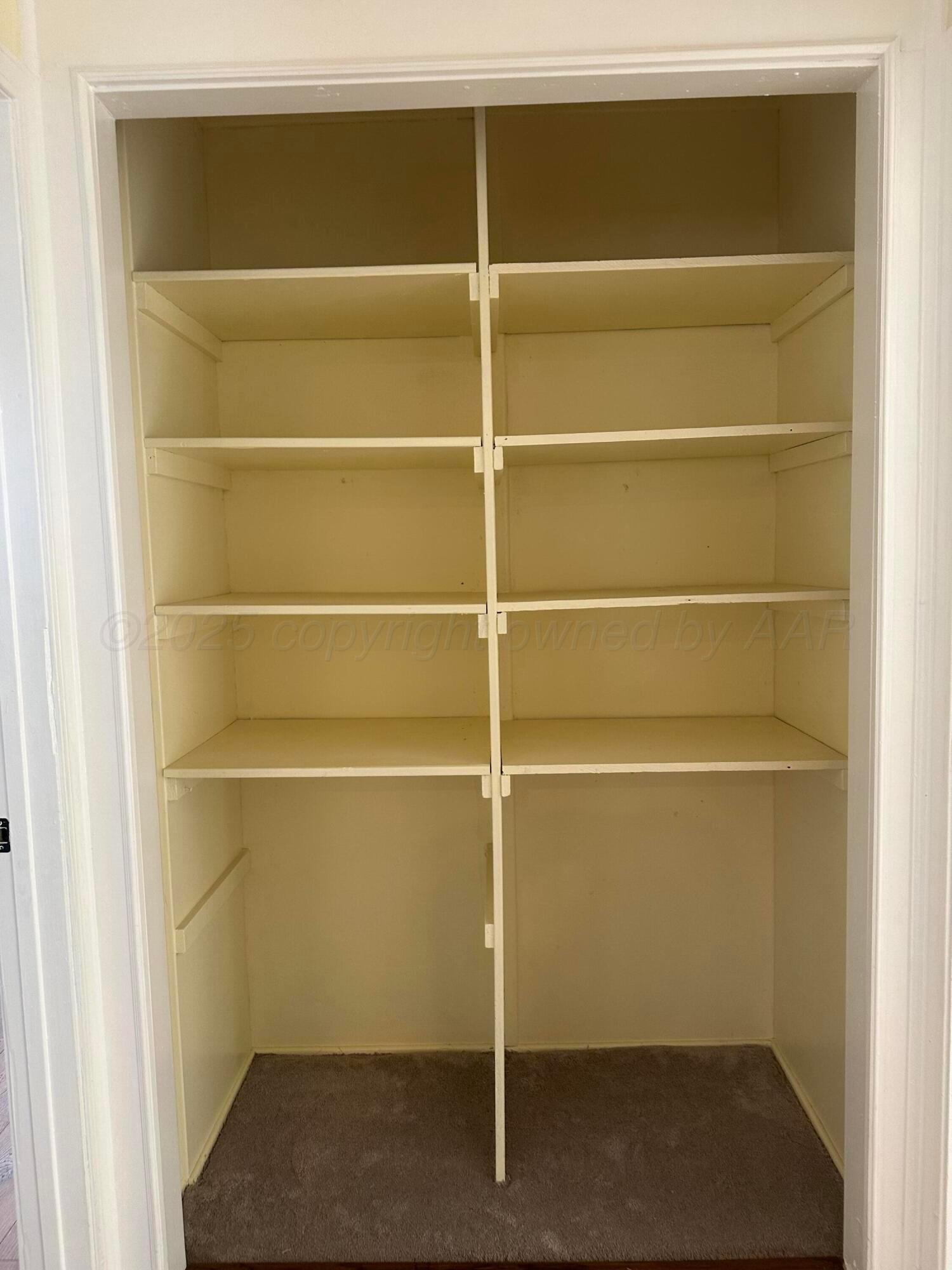 1012 Harper Street Amarillo, TX 79107 - Photo 9 of 22 a view of a room with empty racks