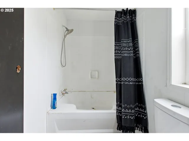 a bathroom with a bathtub and a sink