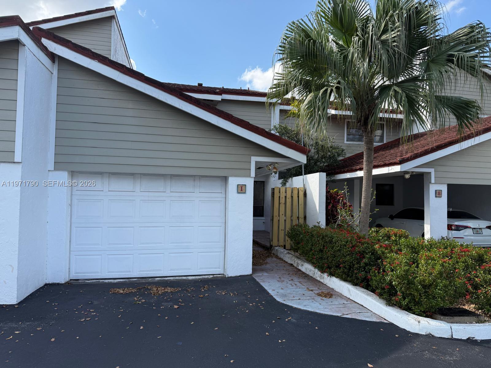 2700 North 34th Avenue, Unit I Hollywood, FL 33021 - Photo 1 of 35 a front view of a house with garden