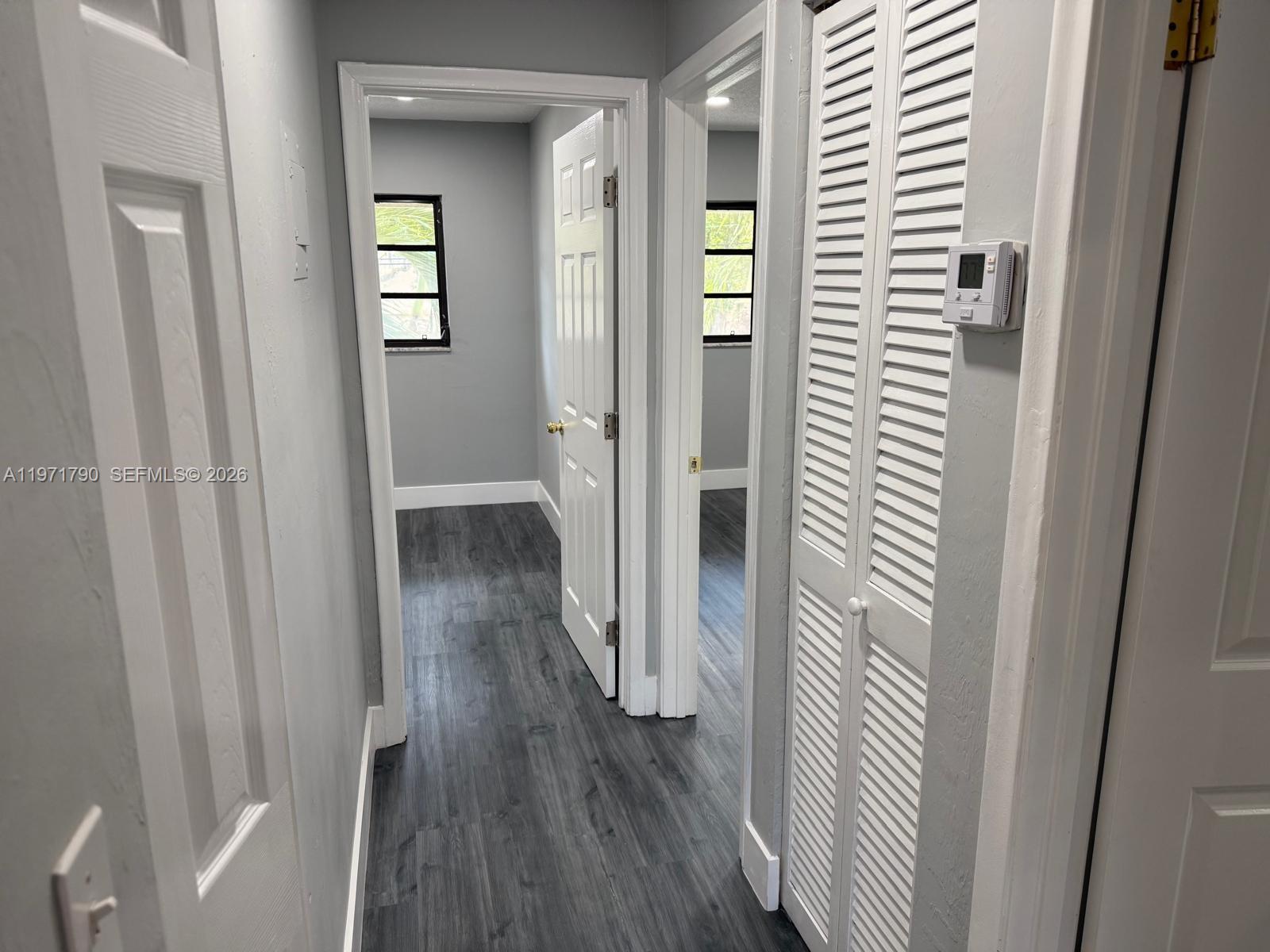 2700 North 34th Avenue, Unit I Hollywood, FL 33021 - Photo 15 of 35 a view of a hallway with wooden floor and closet area