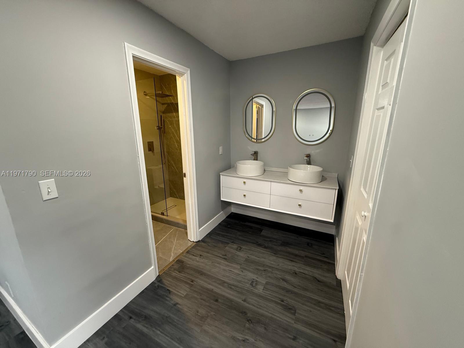 2700 North 34th Avenue, Unit I Hollywood, FL 33021 - Photo 23 of 35 a room with a mirror and a window