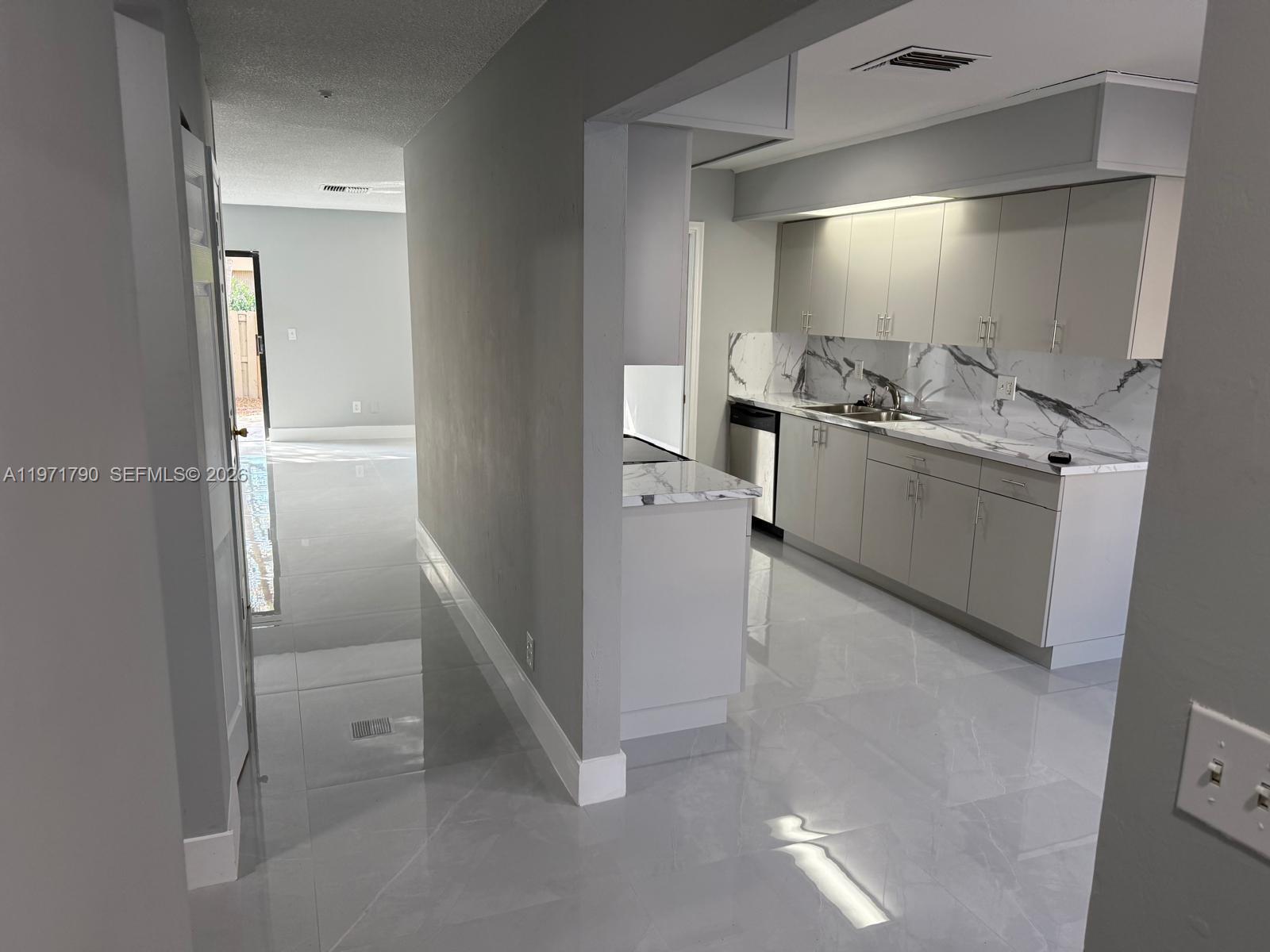 2700 North 34th Avenue, Unit I Hollywood, FL 33021 - Photo 3 of 35 a bathroom with a sink and mirror