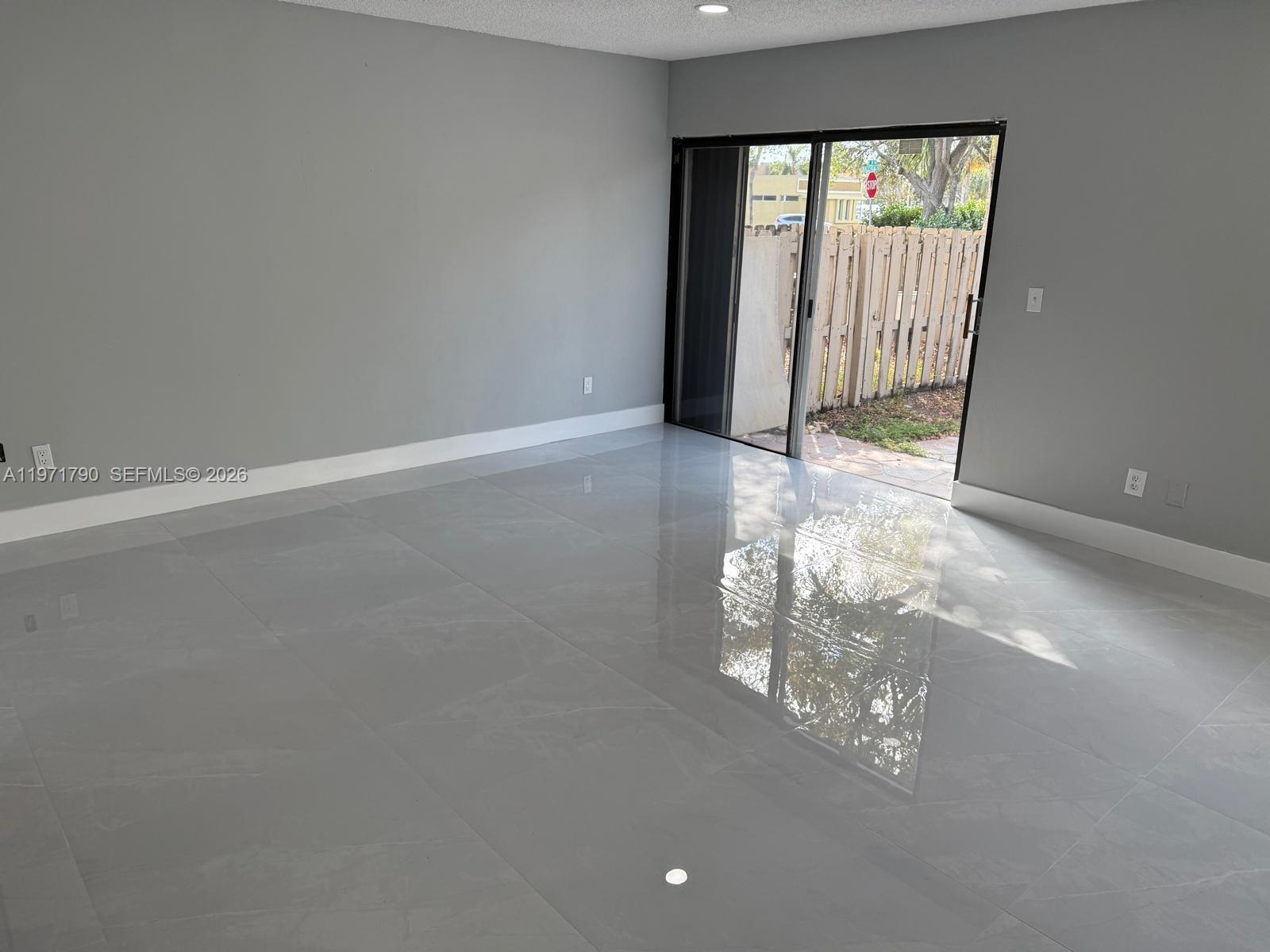 2700 North 34th Avenue, Unit I Hollywood, FL 33021 - Photo 7 of 35 a view of empty room with floor to ceiling window