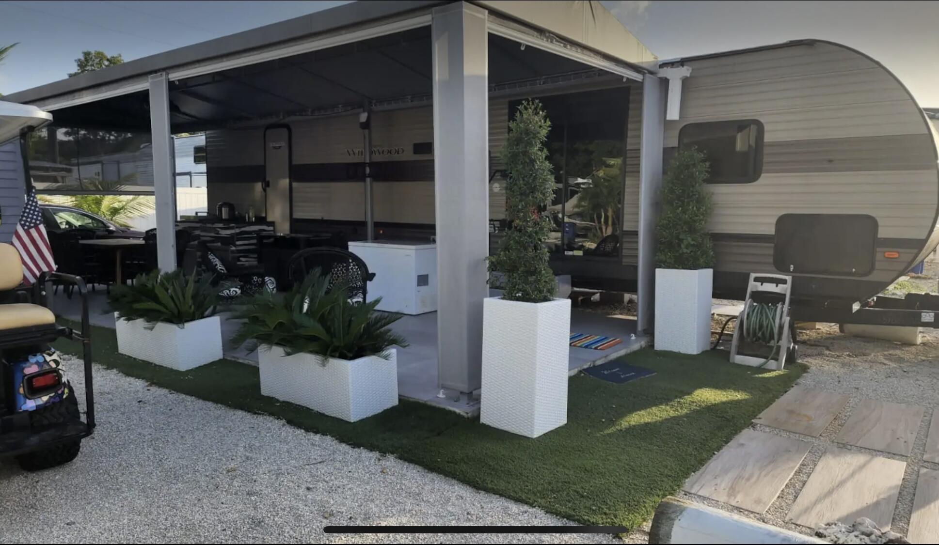 325 Calusa Street, Unit 478 Key Largo, FL 33037 - Photo 1 of 38 a view of a porch with chairs and potted plants