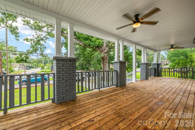 a view of balcony with wooden floor
