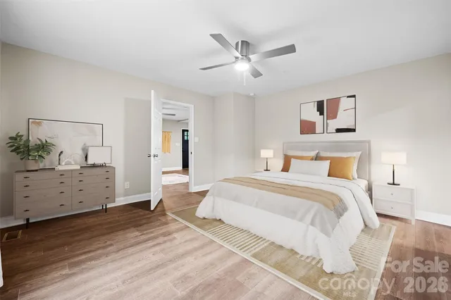 a bedroom with a large bed and a desk