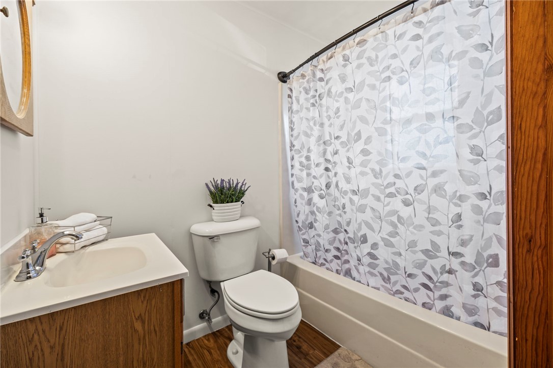 10797 Gratis Jacksonburg Road Somerville, OH 45064 - Photo 14 of 27 This bright bathroom features durable flooring and a convenient shower-tub combination.