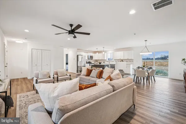 a view of a dining room with furniture window and wooden floor