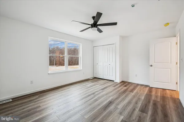a bathroom with a bathtub and toilet