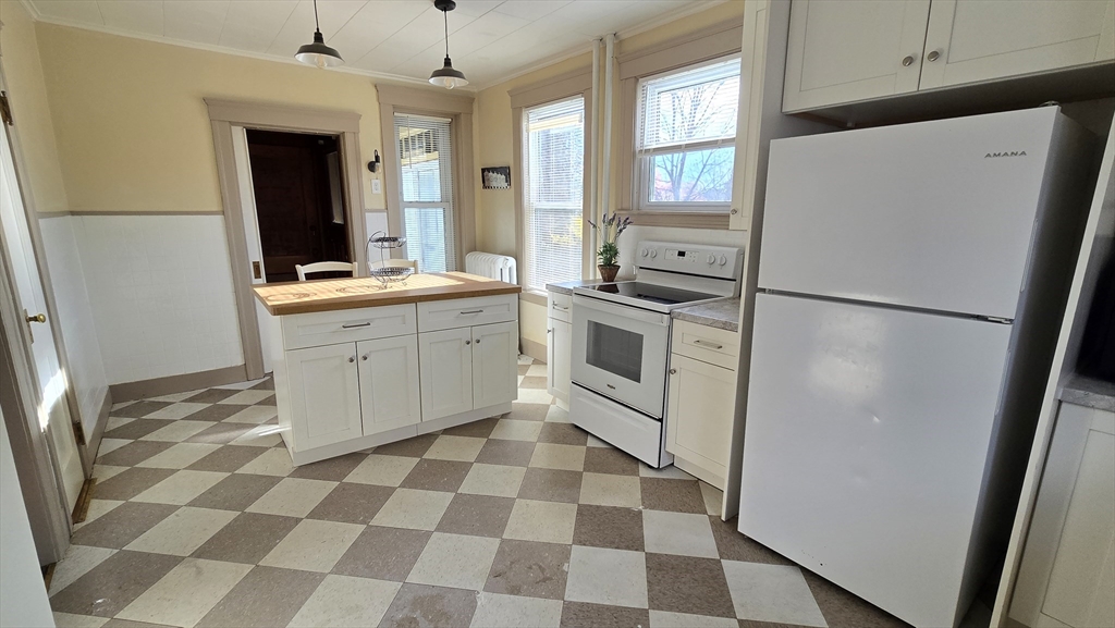 336 Burncoat Street Worcester, MA 01606 - Photo 12 of 40 a kitchen with a refrigerator a sink and dishwasher
