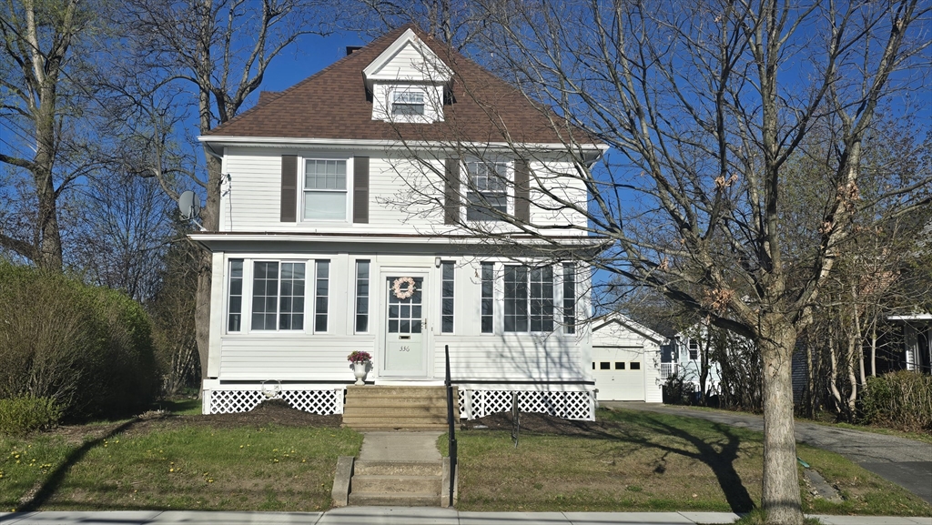 336 Burncoat Street Worcester, MA 01606 - Photo 2 of 40 a front view of a house with a garden