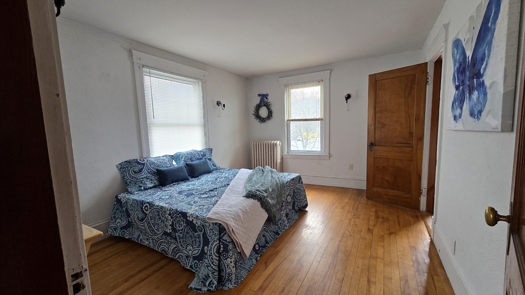 336 Burncoat Street Worcester, MA 01606 - Photo 23 of 40 a bedroom with a bed and a window