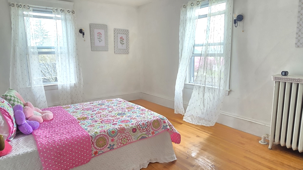 336 Burncoat Street Worcester, MA 01606 - Photo 25 of 40 a bedroom with a bed and a window