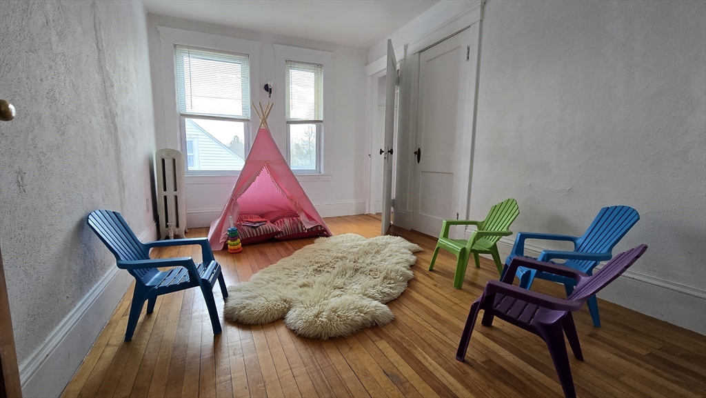 336 Burncoat Street Worcester, MA 01606 - Photo 26 of 40 a workspace with furniture and wooden floor