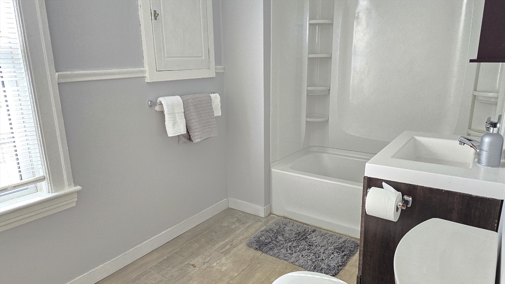 336 Burncoat Street Worcester, MA 01606 - Photo 29 of 40 a bathroom with a sink and bathtub