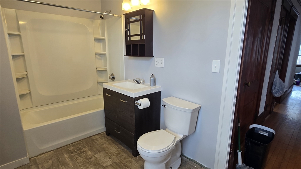 336 Burncoat Street Worcester, MA 01606 - Photo 30 of 40 a bathroom with a toilet a sink and bathtub