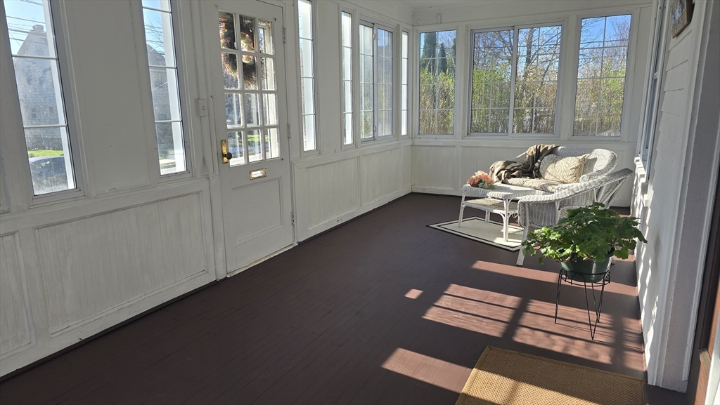 336 Burncoat Street Worcester, MA 01606 - Photo 3 of 40 a living room with furniture and floor to ceiling windows