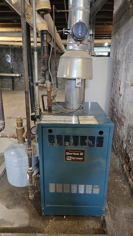 336 Burncoat Street Worcester, MA 01606 - Photo 36 of 40 a stove top oven sitting inside of a kitchen