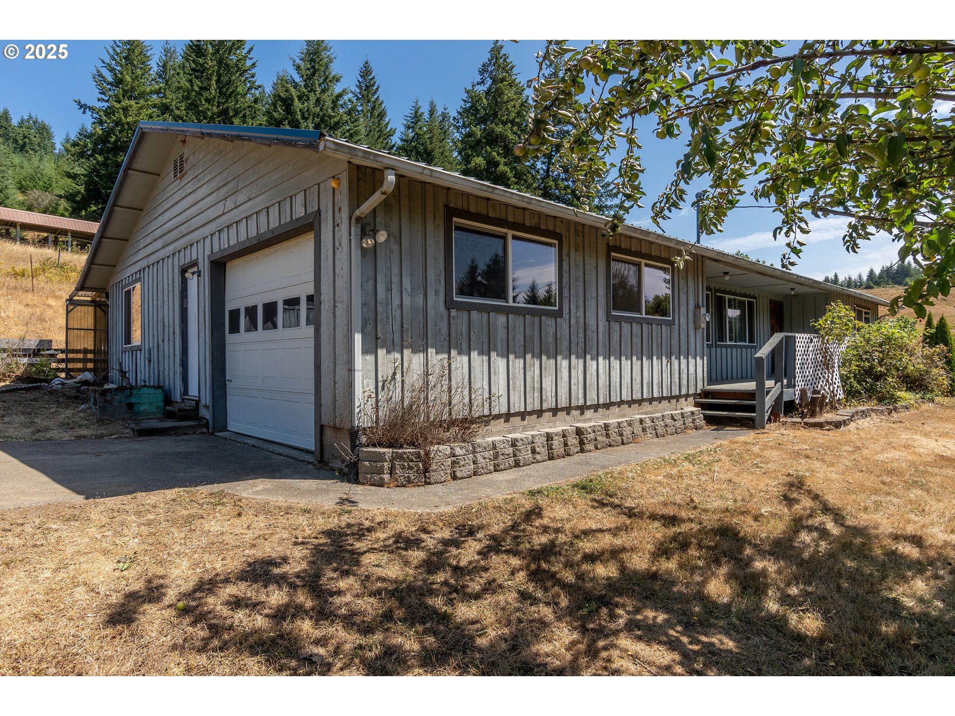 92433 Ward Creek Lane Myrtle Point, OR 97458 - Photo 1 of 38 a view of a small house in middle of the yard