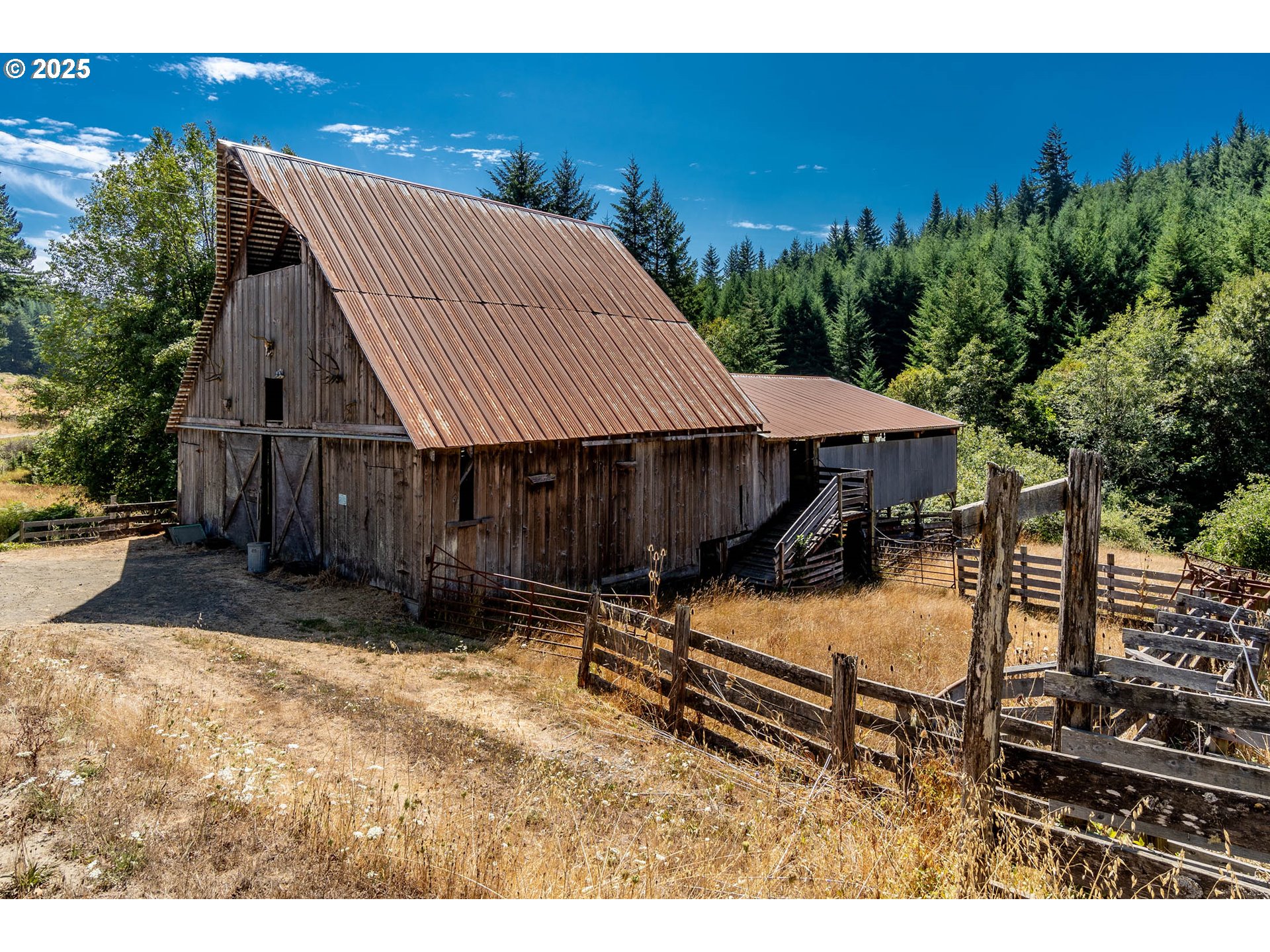 92433 Ward Creek Lane Myrtle Point, OR 97458 - Photo 29 of 38 a backyard of a house with barbeque oven and outdoor seating
