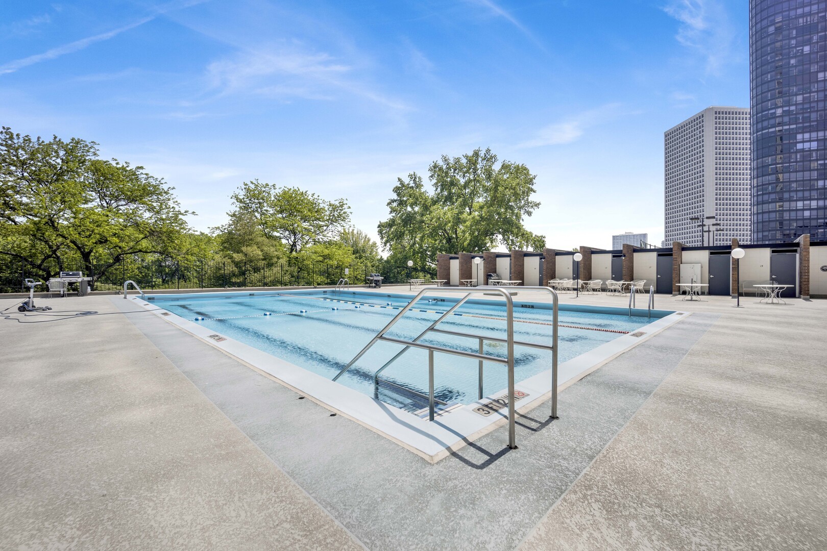 5455 North Sheridan Road, Unit 3611 Chicago, IL 60640 - Photo 15 of 18 a view of a tennis ground with large trees