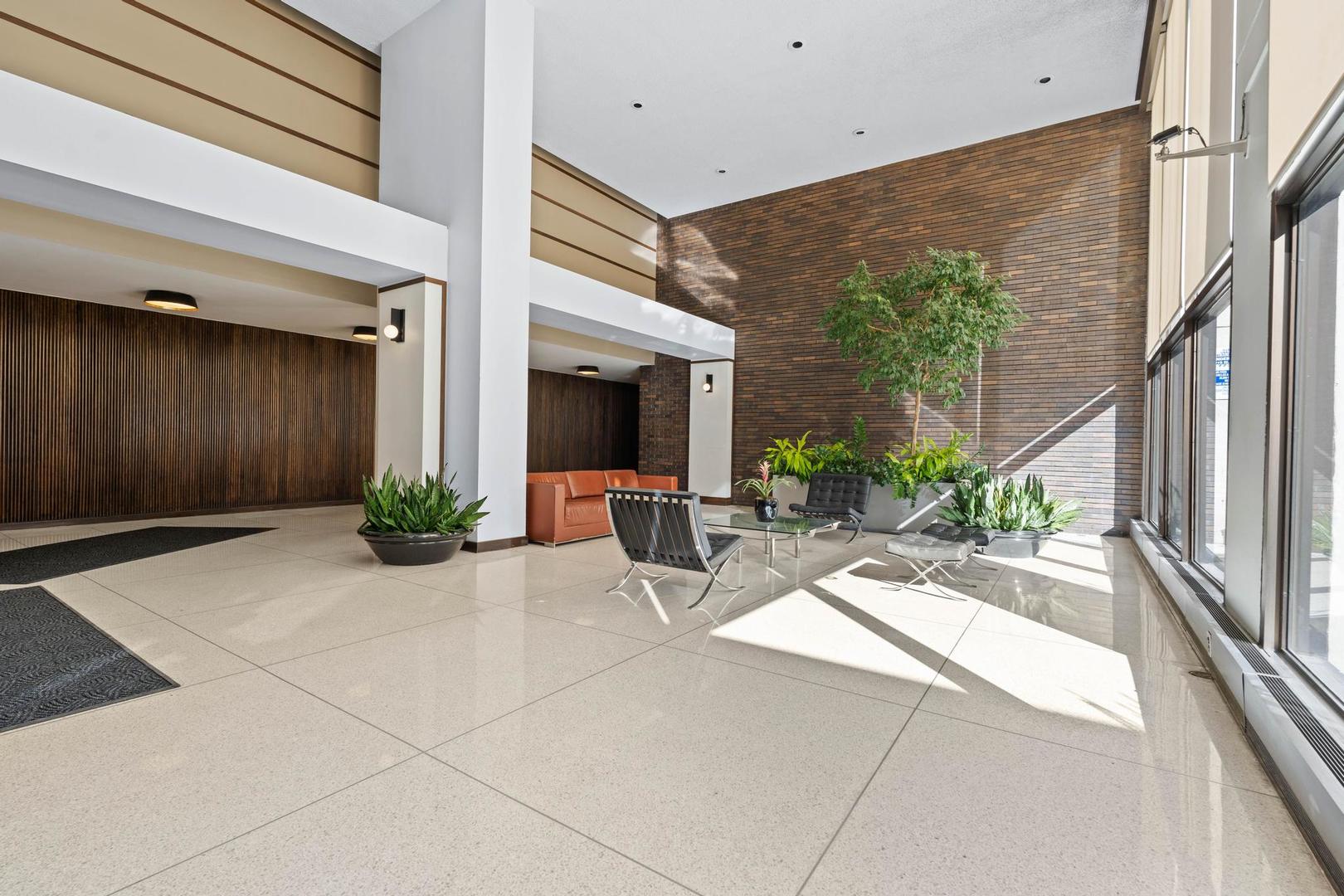 5455 North Sheridan Road, Unit 3611 Chicago, IL 60640 - Photo 2 of 18 a view of a patio with couches and potted plants