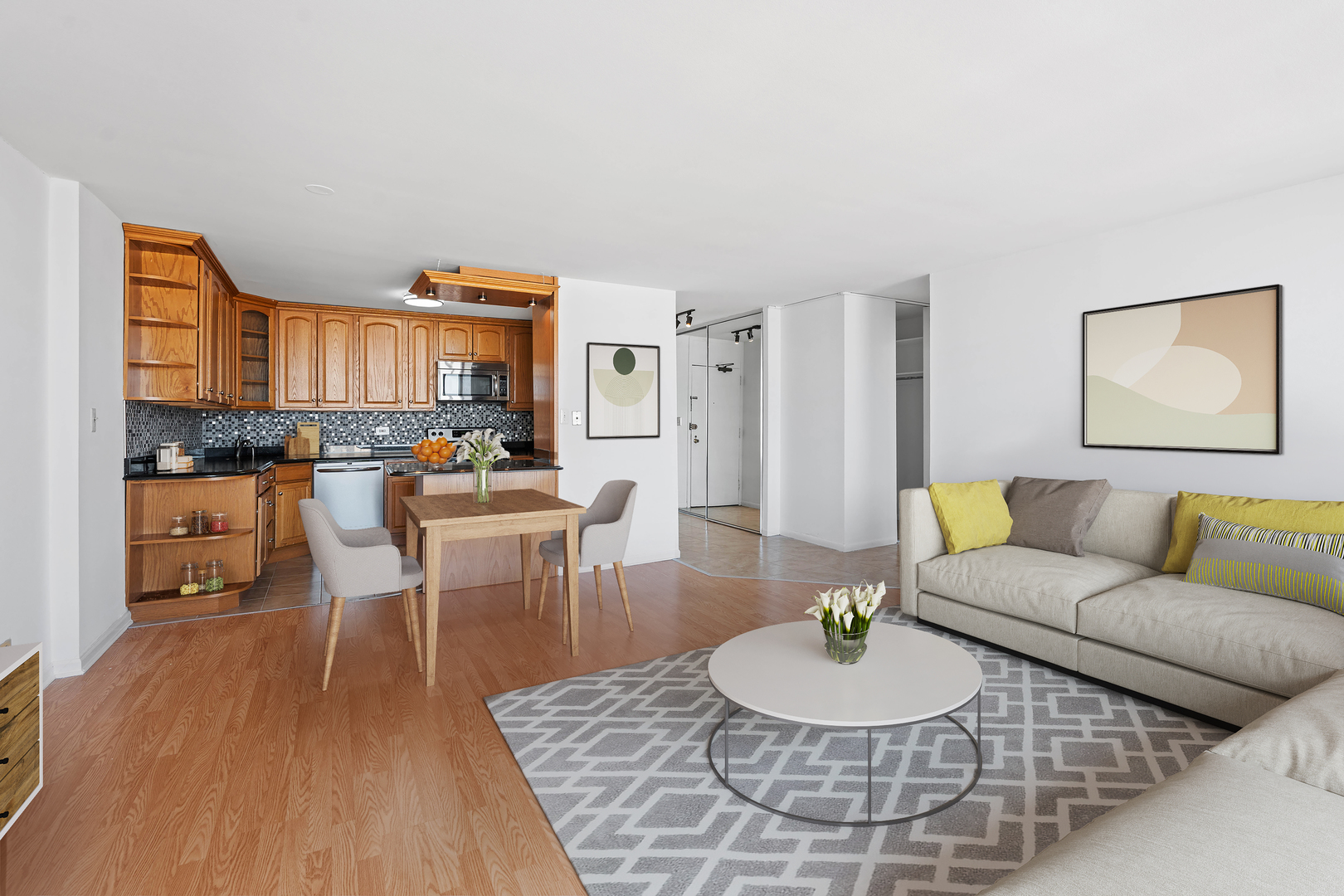 5455 North Sheridan Road, Unit 3611 Chicago, IL 60640 - Photo 4 of 18 a living room with furniture a dining table and a kitchen view