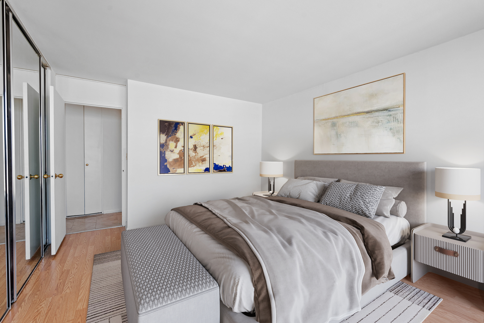 5455 North Sheridan Road, Unit 3611 Chicago, IL 60640 - Photo 6 of 18 a bedroom with a bed and a painting on the wall