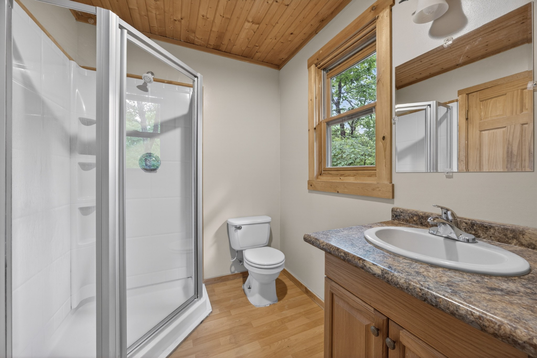 55214 Maynard Ridge Lane Crawford, TN 38554 - Photo 16 of 32 a bathroom with a granite countertop sink toilet and shower