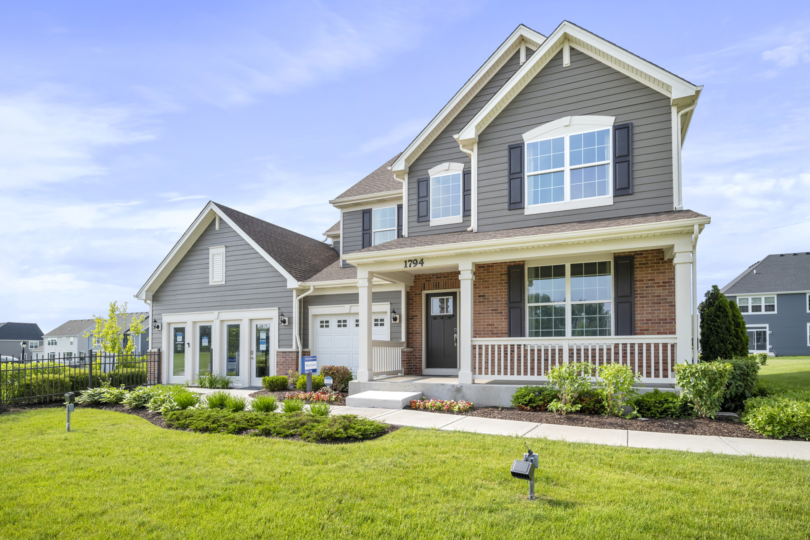 3664 Edelweiss Road Elgin, IL 60124 - Photo 2 of 31 a front view of a house with a yard and potted plants