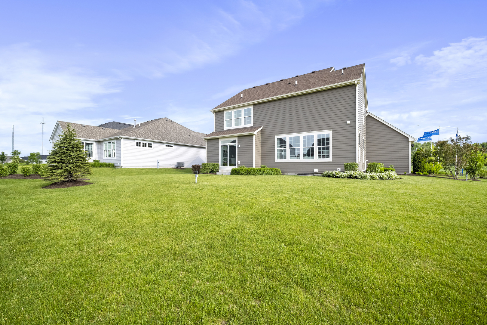 3664 Edelweiss Road Elgin, IL 60124 - Photo 4 of 31 a large house with a big yard and front view of a house