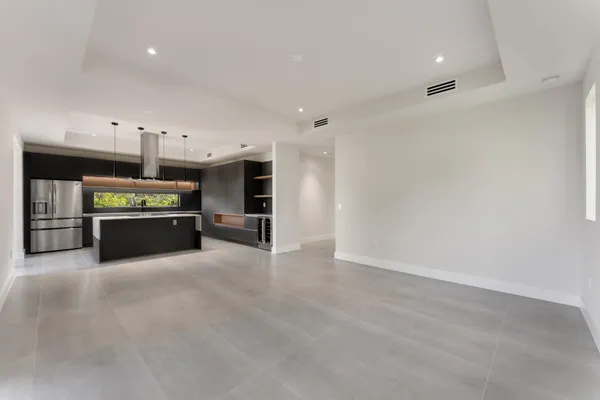a kitchen that has a sink and a stove
