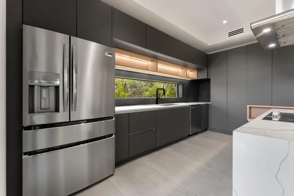 a kitchen with a stove and a kitchen island