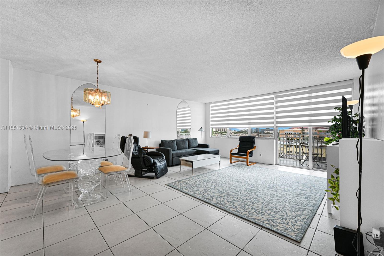 2100 Sans Souci Boulevard, Unit A509 North Miami, FL 33181 - Photo 12 of 44 a living room with fireplace furniture and a window